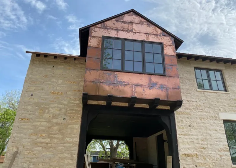 Copper metal panel facade on a stone building for Skylight Installation in Dana Point