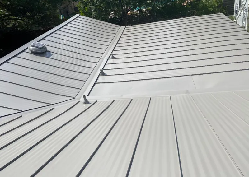 Solar attic fan installed on a metal roof for Roof Ventilation in Dana Point